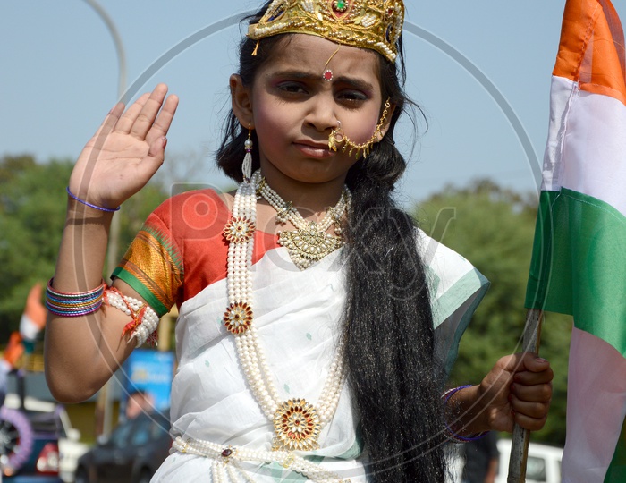 An Indian Girl Child In Bharath Mata  Makeup Or Attire at Independence Day Celebrations