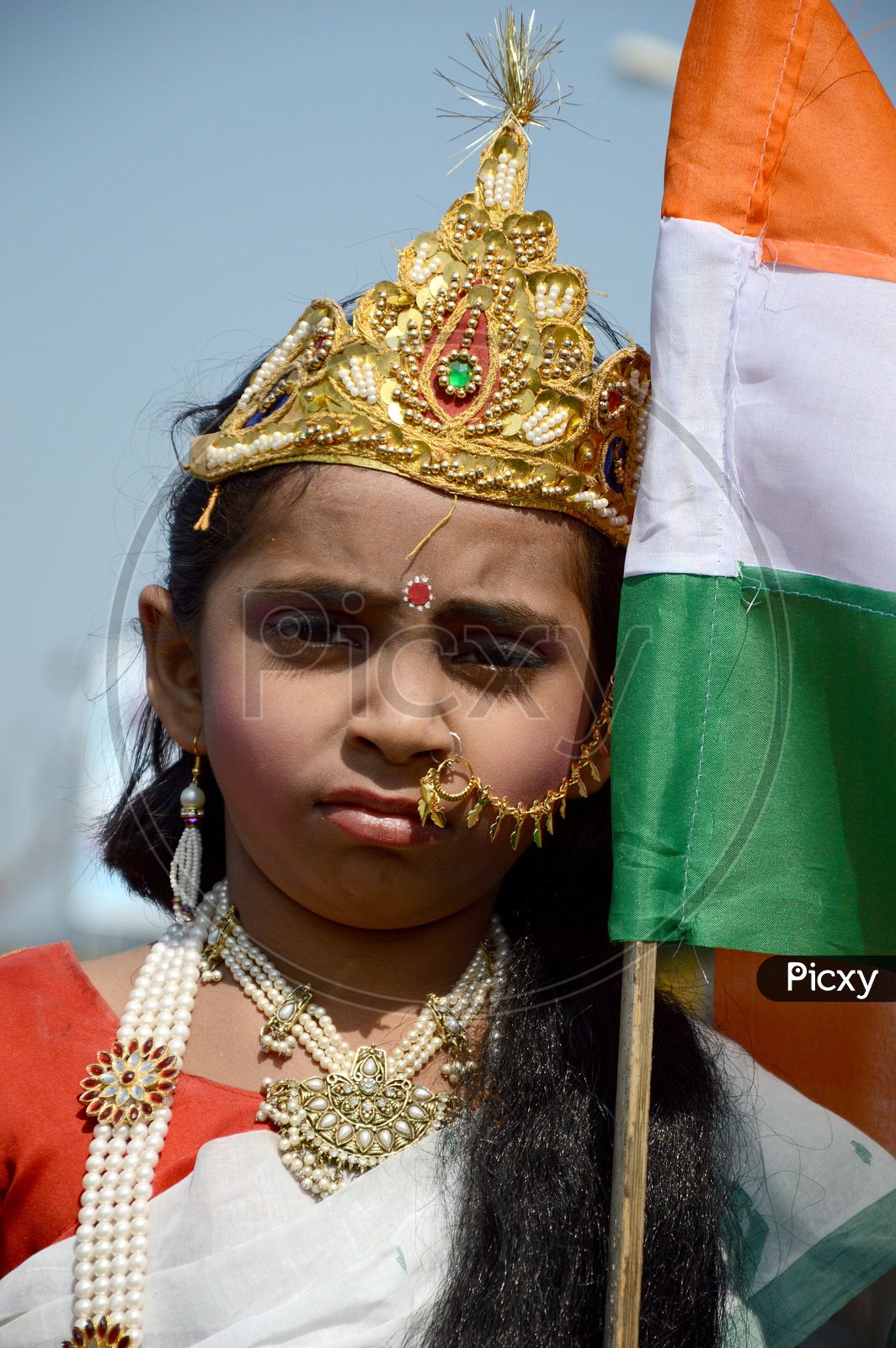An Indian Girl Child In Bharath Mata  Makeup Or Attire at Independence Day Celebrations