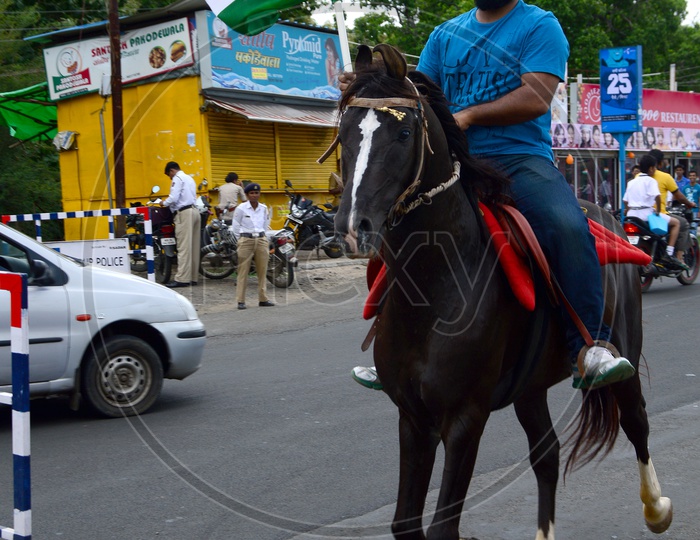 A Sikh Man With Indian National Flag Riding a Horse
