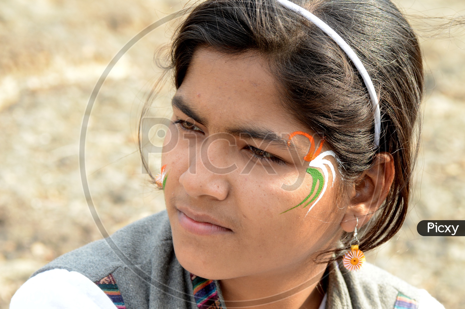 Indian Young People Pasting Indian National Tri-Colors On the Cheek Celebrating Independence Day