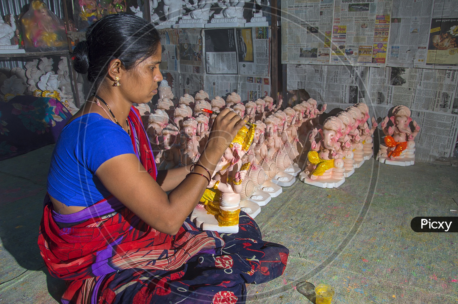 An Artist Making Lord Ganesh Idols In a Workshop For Ganesh Chathurdhi  Festival