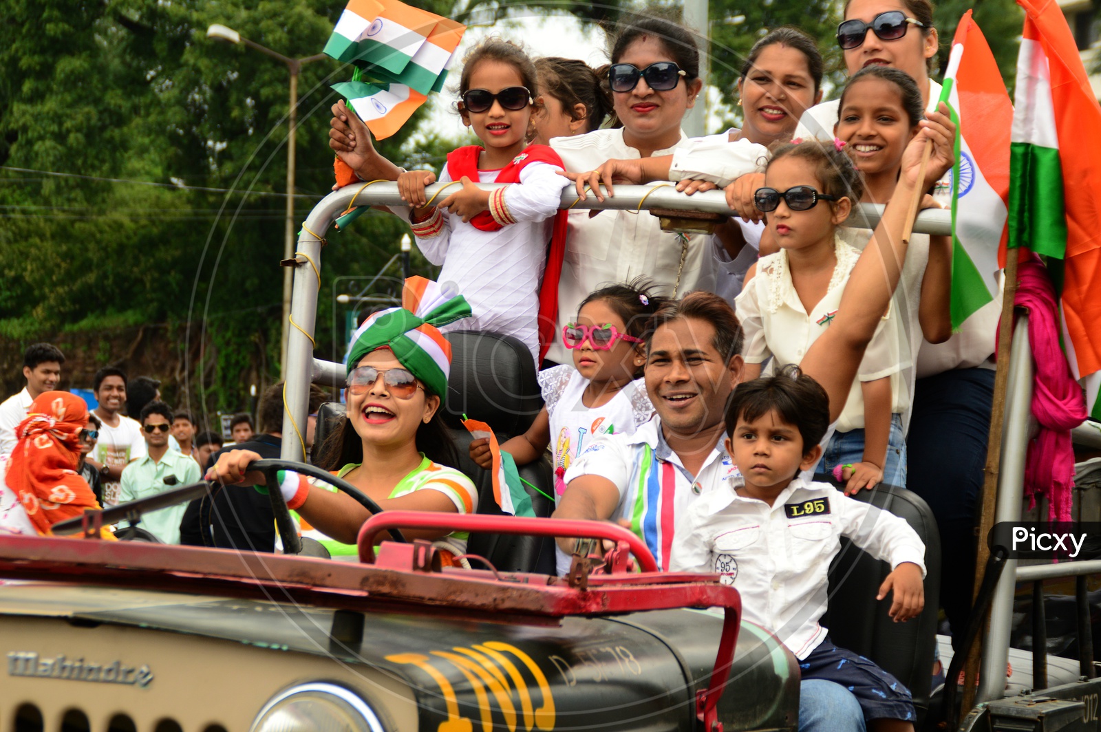 Young Indian People With   Indian National Flag ( Tri-Color ) Celebrating Independence Day
