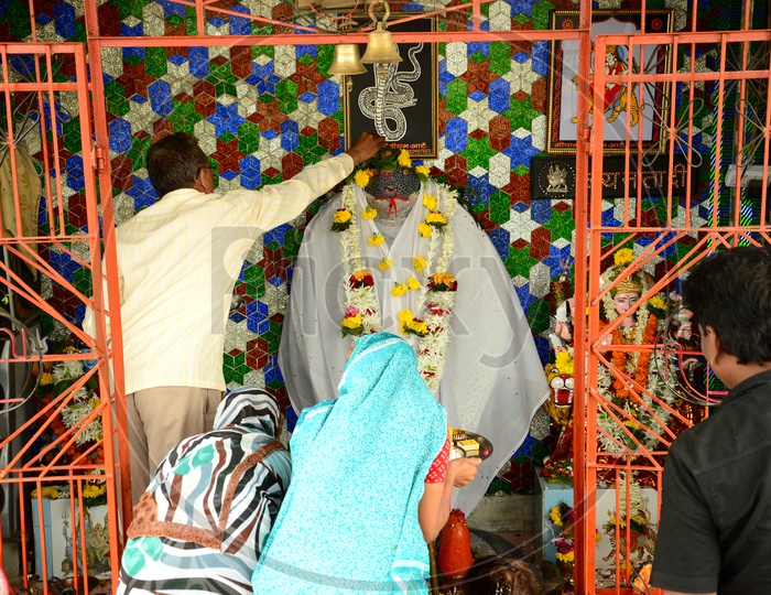 Devotees offering prayers in a temple