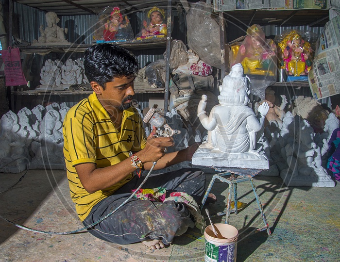 An Artist Making Lord Ganesh Idols In a Workshop For Ganesh Chathurdhi  Festival