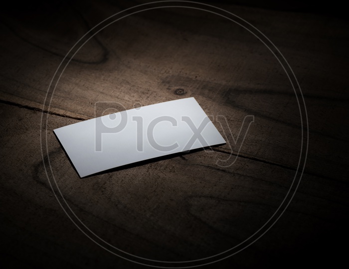 White Placard  On an Wooden Background