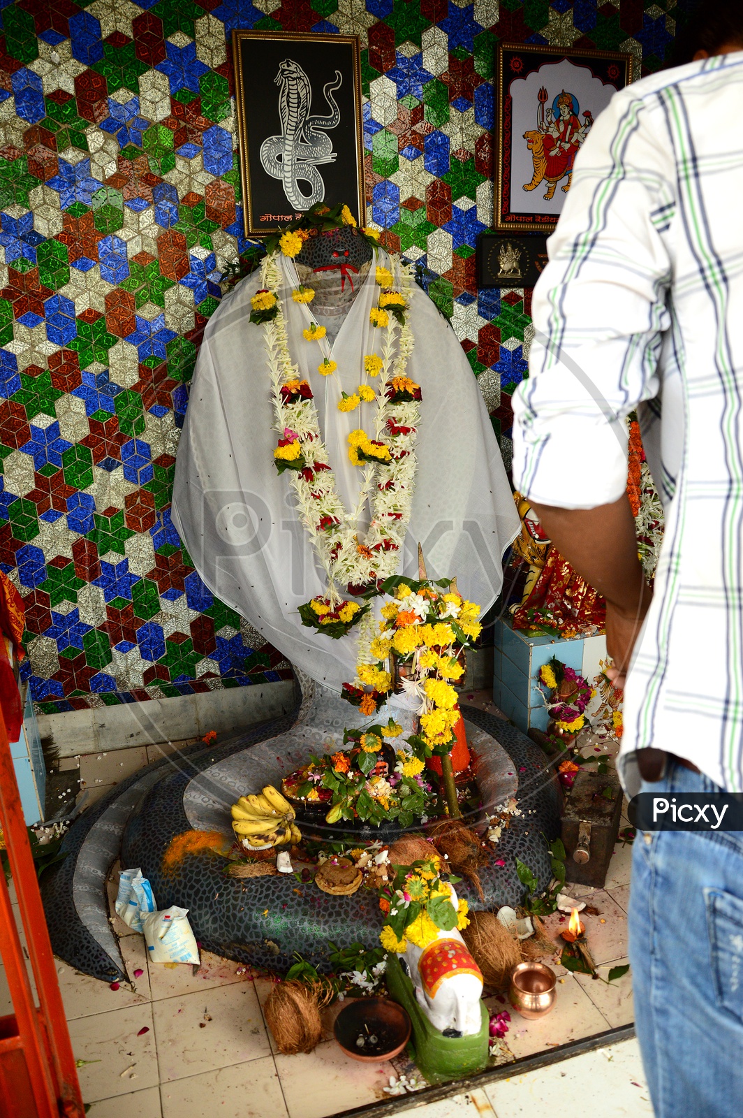 Devotees offering prayers in a temple