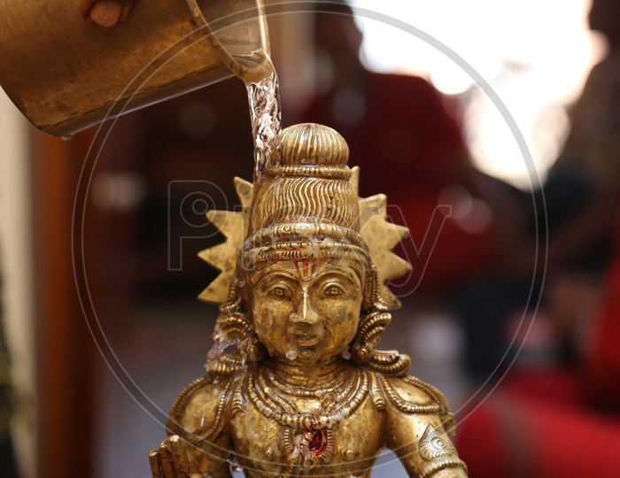 abhishekam is the showering of water on  Lord Ayyappa