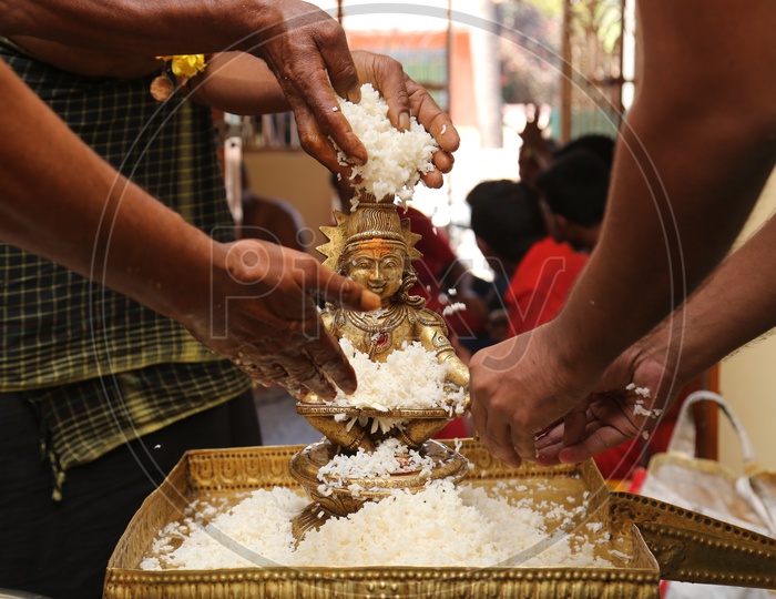 showering of rice on  Lord Ayyappa