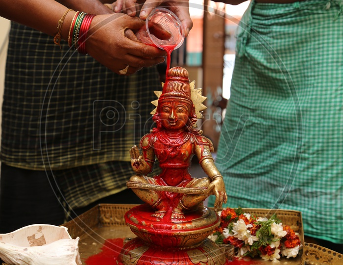kumkumabhishekam is the showering of red powder water on  Lord Ayyappa
