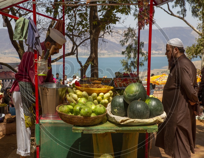 Man selling fruits near Parsi point, Panchgani