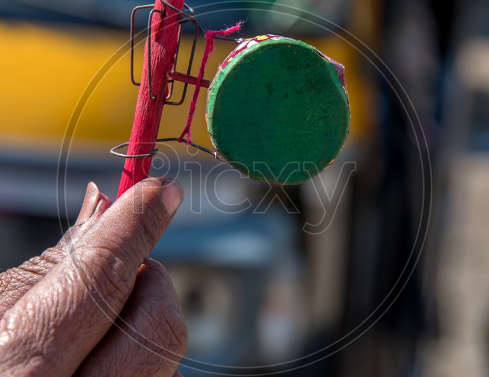 Colorful Handmade Baby Rattle ( Mini Drum ) Toy Selling By a Vendor  On The Rural Indian Villages