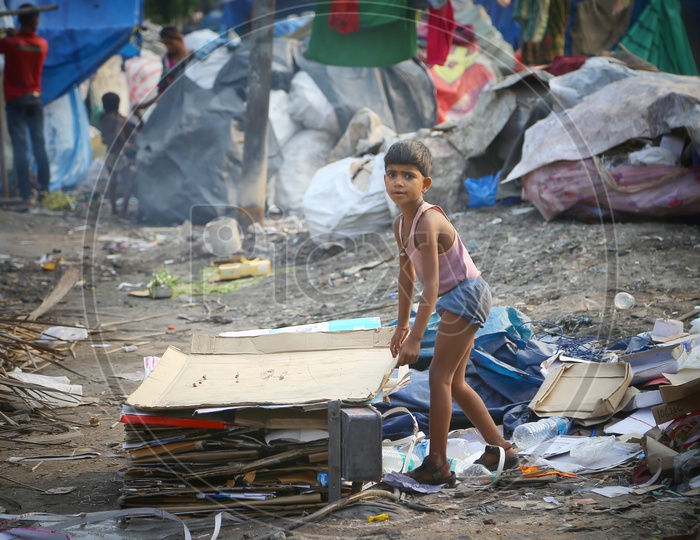 Indian  Slum Area  Kid Or Children Or Boy  Collecting  Papers