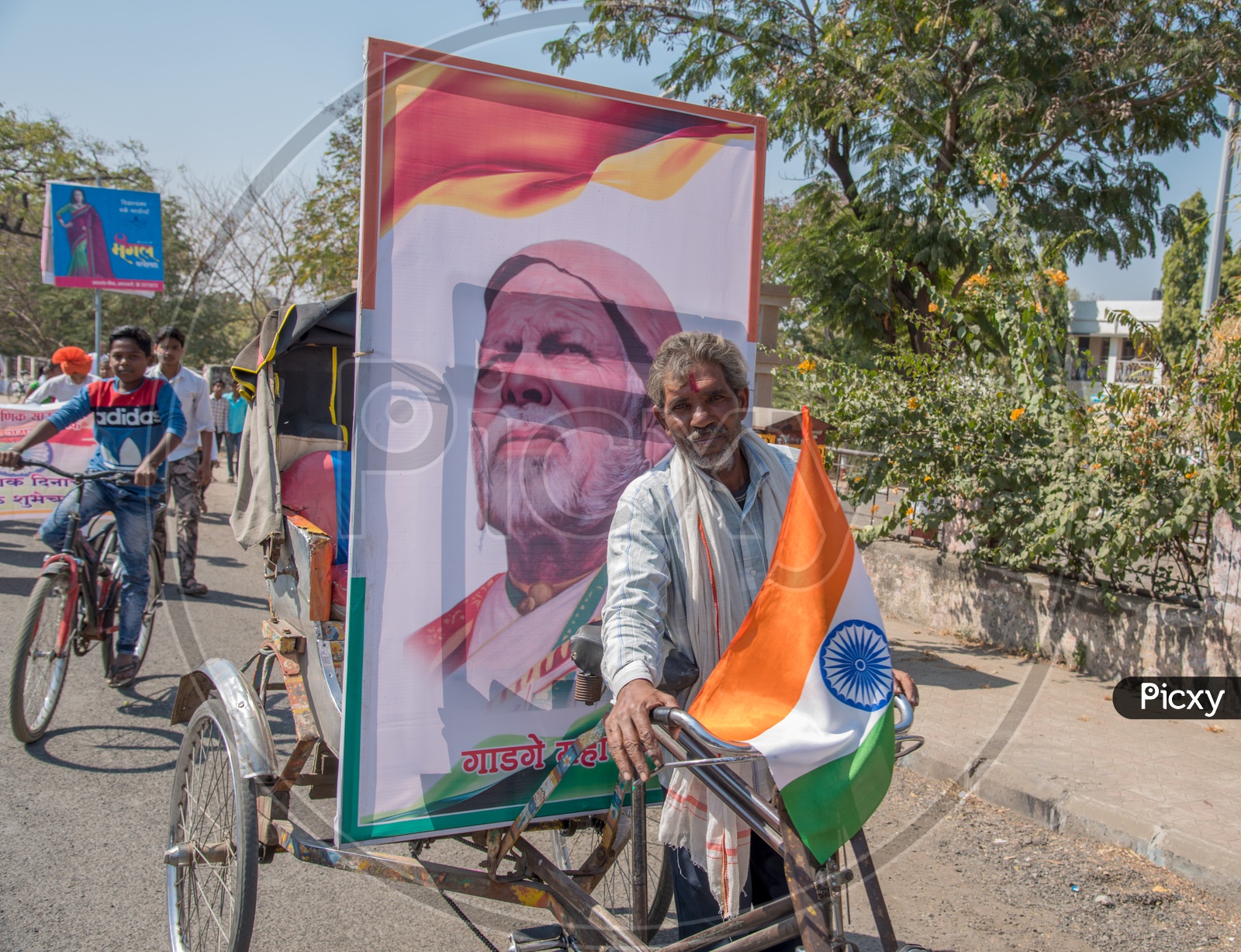 Indian Rickshaw Pullers Carrying The Freedom Fighters Photo Frames in Rickshaws On The Streets For Republic  Day