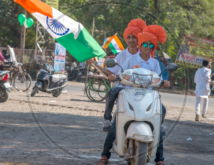 Indian People Waving The Indian National Tri Color Flags On The Indian Streets For Republic Day