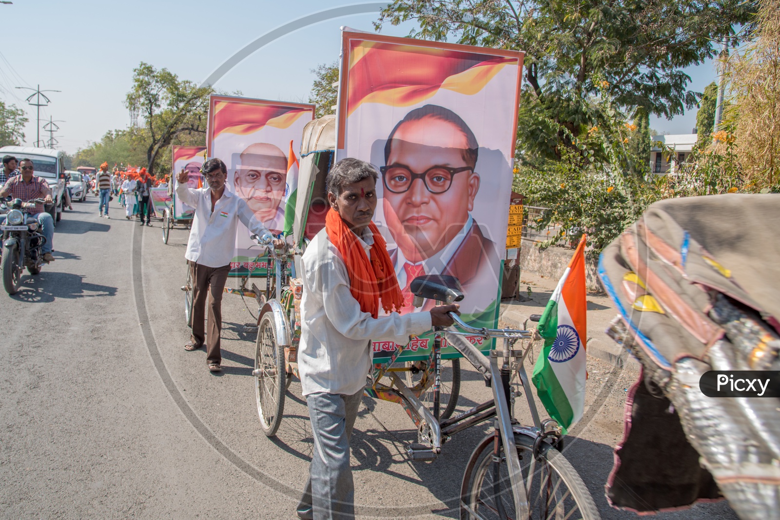 Indian Rickshaw Pullers Carrying Dr. B R Ambedkar Photo Frames in Rickshaws On The Streets For Republic  Day