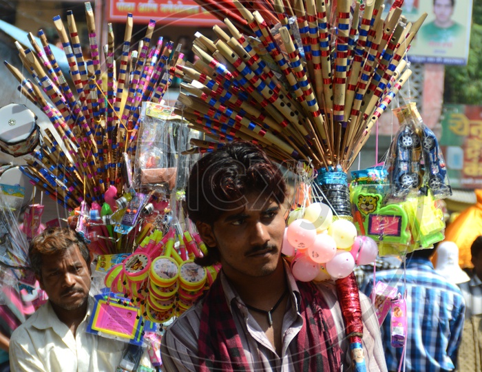 A Flute Vendor On The Streets Of Nagpur During Marbat Procession
