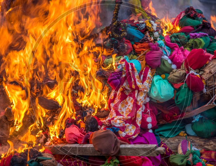 Indian People Celebrating Holika Dahan  a Worship By Firing Wooden Logs And Dried Coconuts on  the Eve Of Holi .Also Called as Festival Of Colors