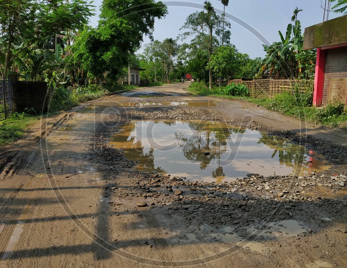 Image of Potholes Filled With Rain Water on Rural Village Roads in ...