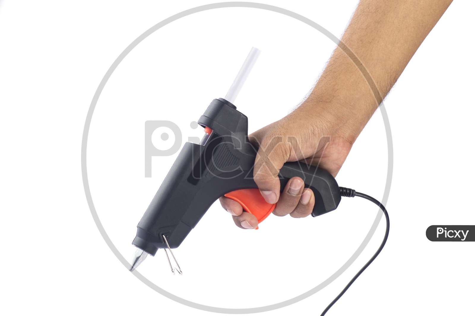 A Man Holding a Hot Glue Gun In Hand Over a White Isolated Background