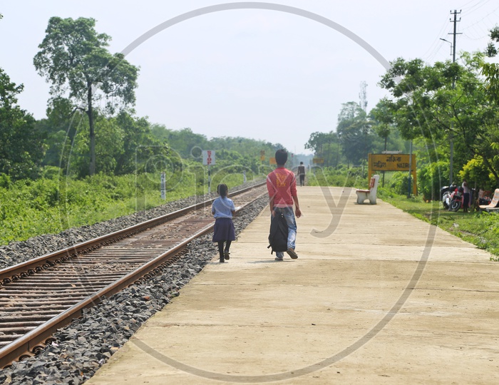 Empty Tracks  in Rural Village Railway Stations  With Passengers  on Platform