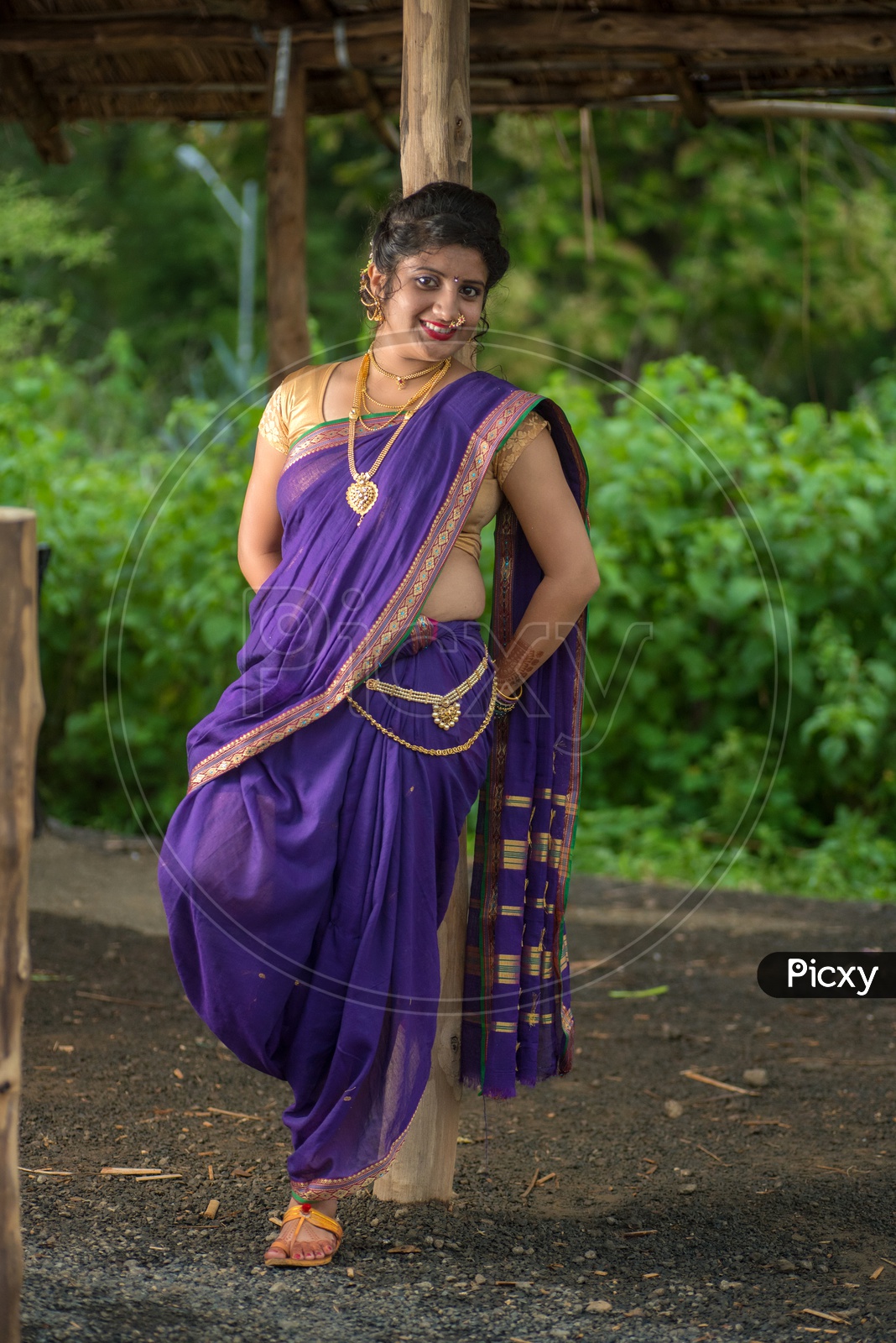 Image of Indian traditional Beautiful Woman Wearing an traditional Saree  And Posing On The Outdoor With a Smile Face-QP185219-Picxy