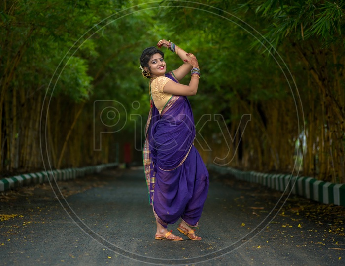 Beautiful Indian young girl in Traditional Saree posing outdoors 5045474  Stock Photo at Vecteezy