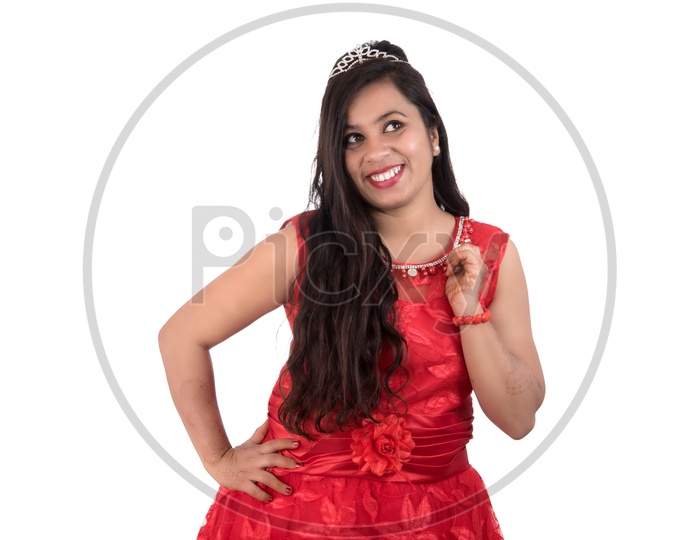Portrait of a Beautiful Young Woman Standing And Posing With  A Smiling Face  On an Isolated white Background