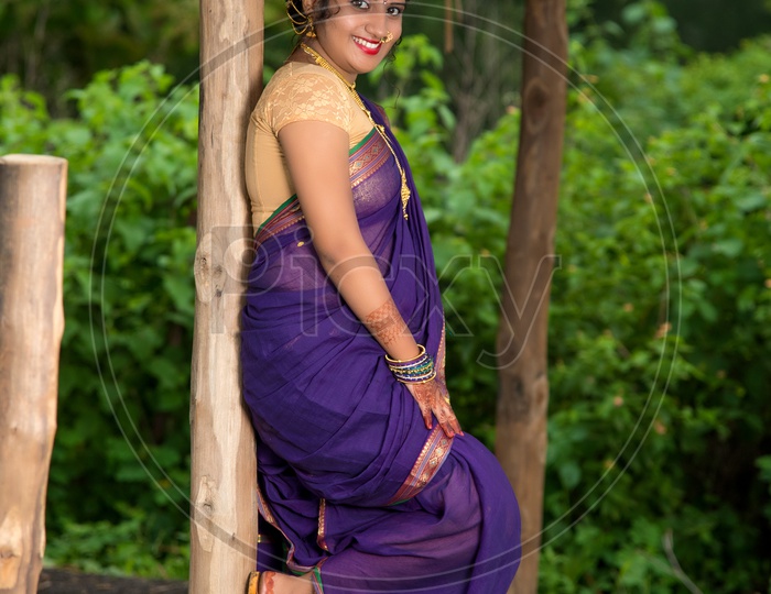 Beautiful Indian Young Girl In Traditional Saree Posing Outdoors Stock Photo,  Picture and Royalty Free Image. Image 147639275.