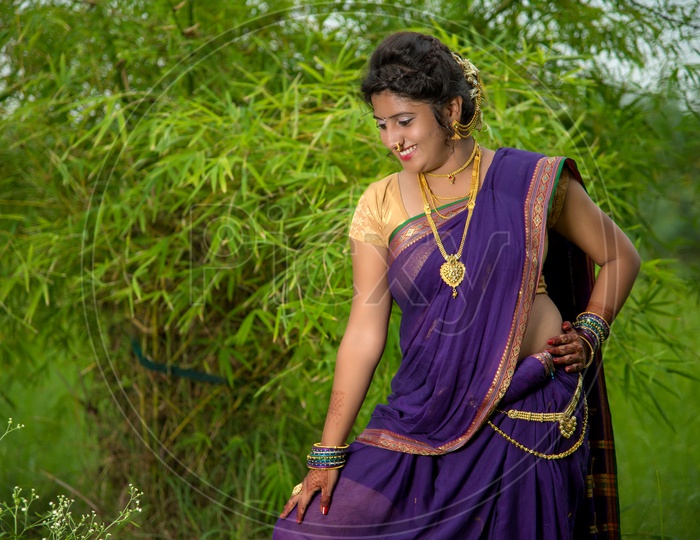 Indian Traditional Beautiful young girl in saree posing outdoors 4982420  Stock Photo at Vecteezy