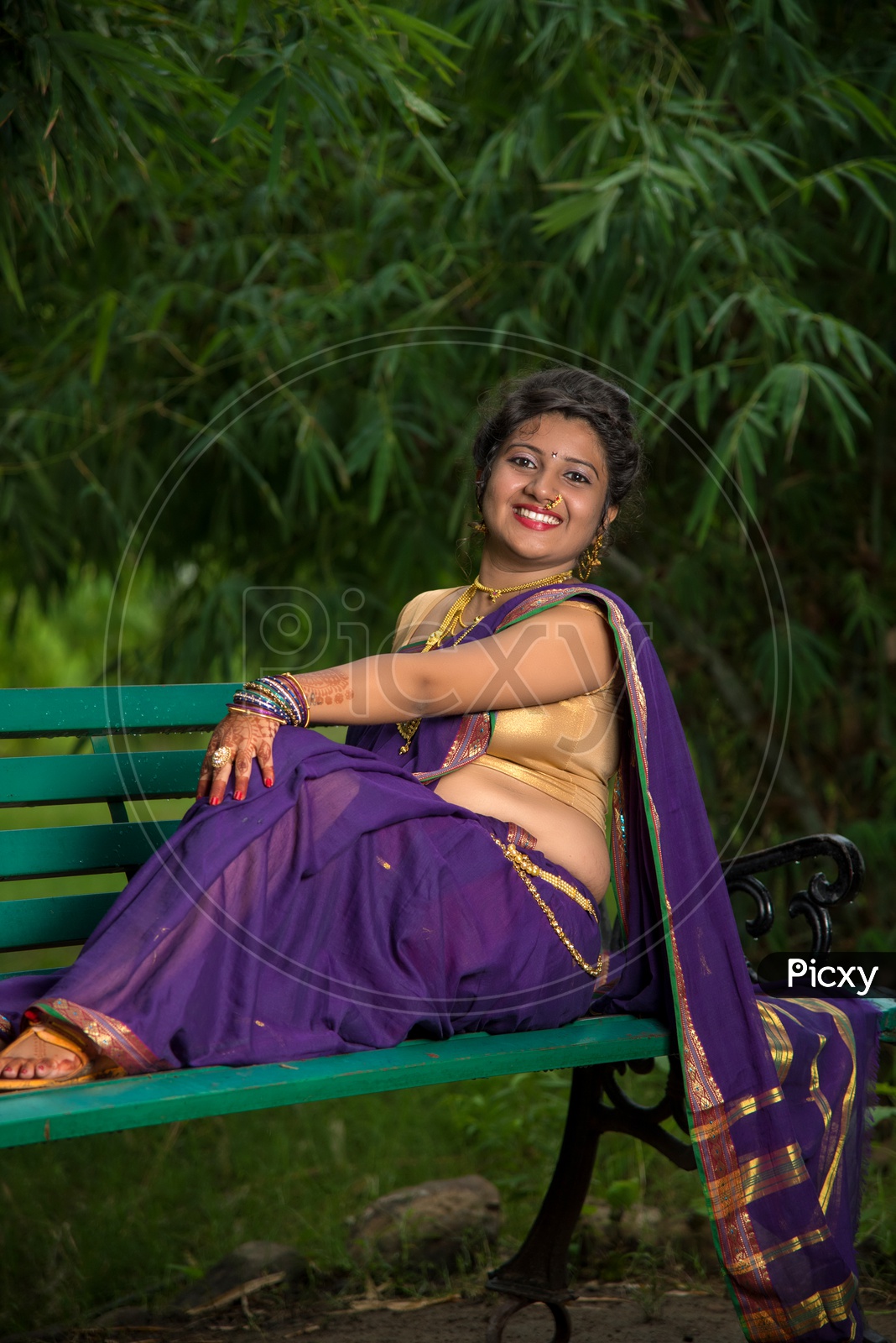 Sitting pose in indian sarees Stock Photos - Page 1 : Masterfile