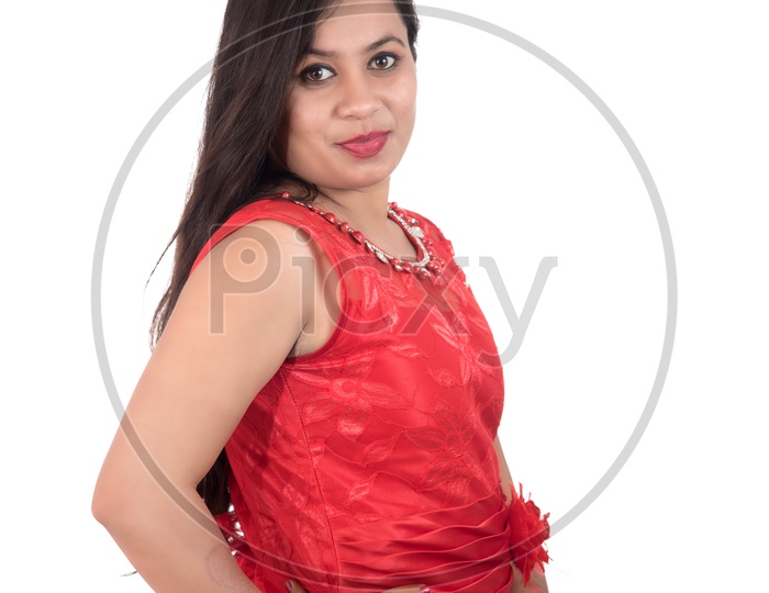 Portrait of a Beautiful Young Woman Standing And Posing With  A Smiling Face  On an Isolated white Background