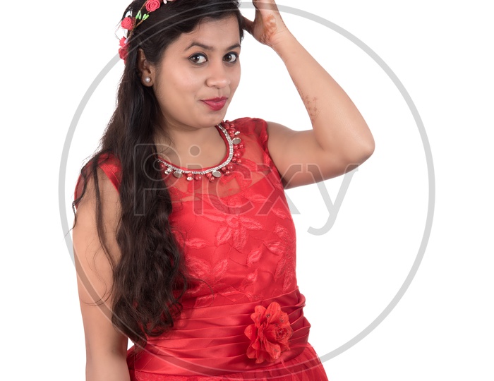 Portrait of a Beautiful Young Woman Standing And Posing With a Smile Face On an Isolated white Background