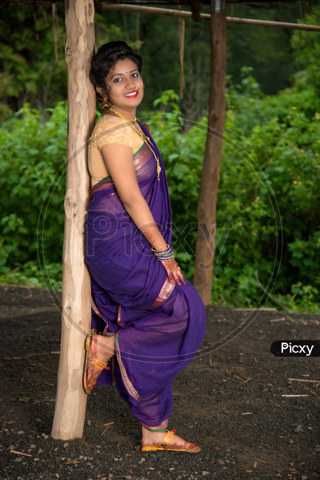 Image of Indian traditional Beautiful Woman Wearing an traditional Saree  And Posing On The Outdoor With a Smile Face-US485157-Picxy