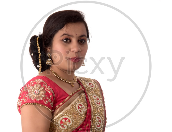 Young Traditional Indian Woman Wearing a Elegant Saree And Posing on an Isolated White Background