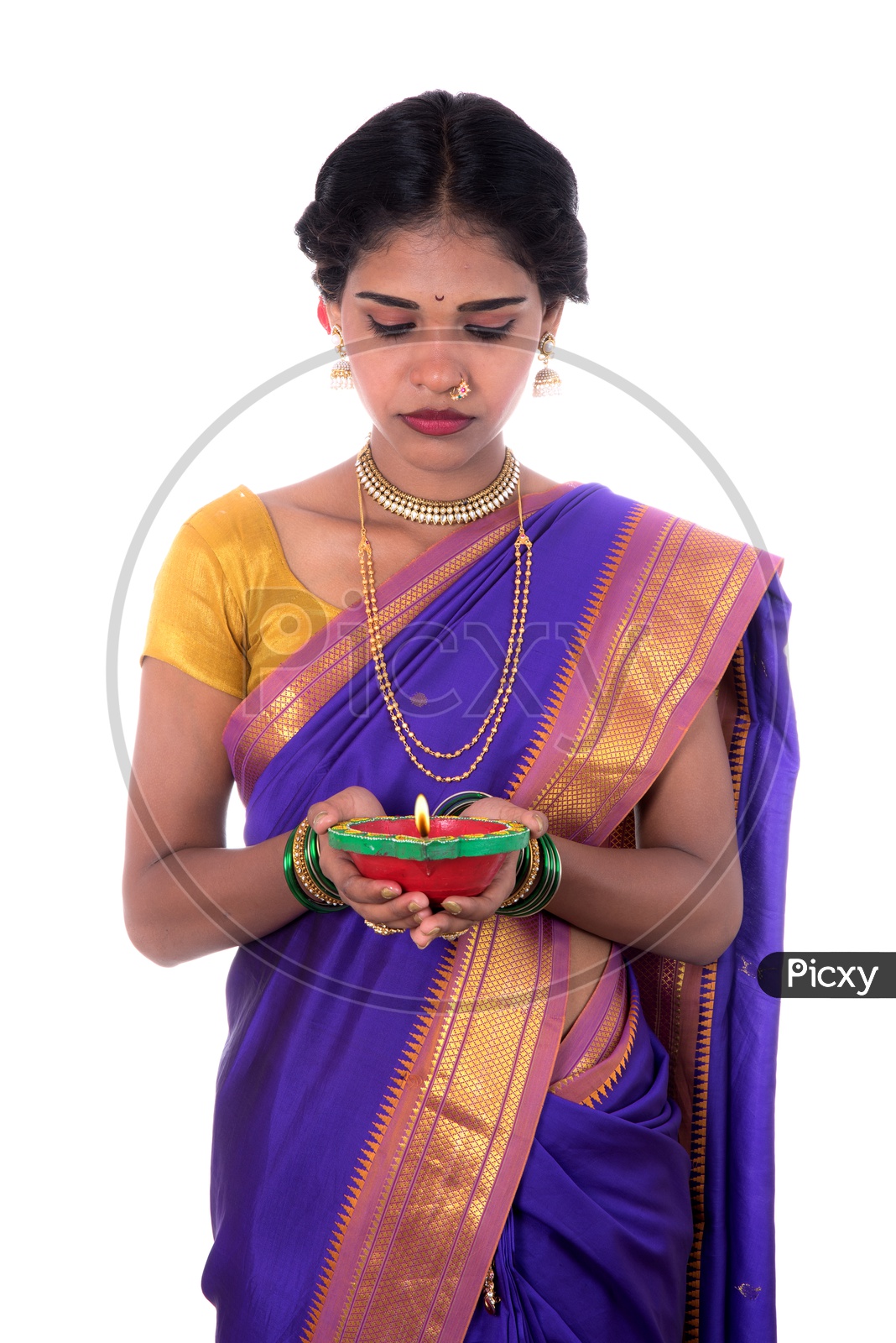 Portrait of a woman holding diya, Diwali or deepavali photo with female hands holding oil lamp during festival of light on white background