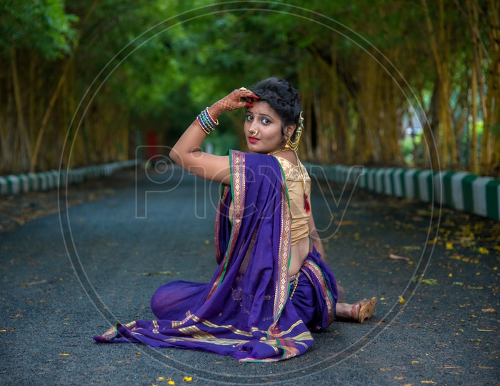 Indian Traditional Beautiful Young Girl In Saree Posing Outdoors Stock  Photo, Picture and Royalty Free Image. Image 147641968.