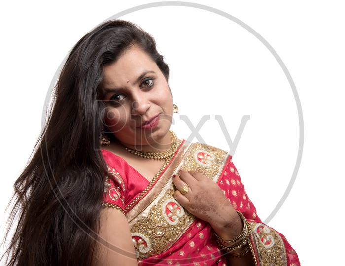 Image of Young Traditional Indian Woman Wearing a Elegant Saree And Posing  on an Isolated White Background-CL015606-Picxy