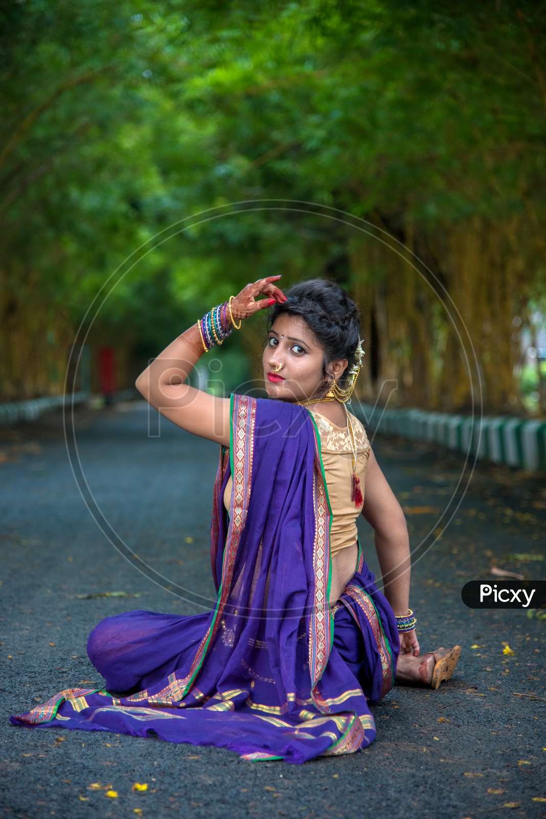Image of Indian traditional Beautiful Woman Wearing an traditional Saree  And Posing On The Outdoor With a Smile Face-WN768357-Picxy