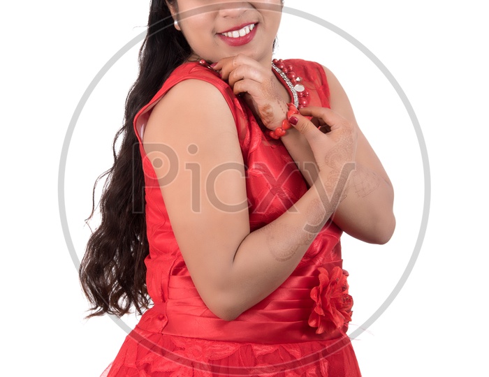 Portrait of a Beautiful Young Woman Standing And Posing With a Smile Face On an Isolated white Background