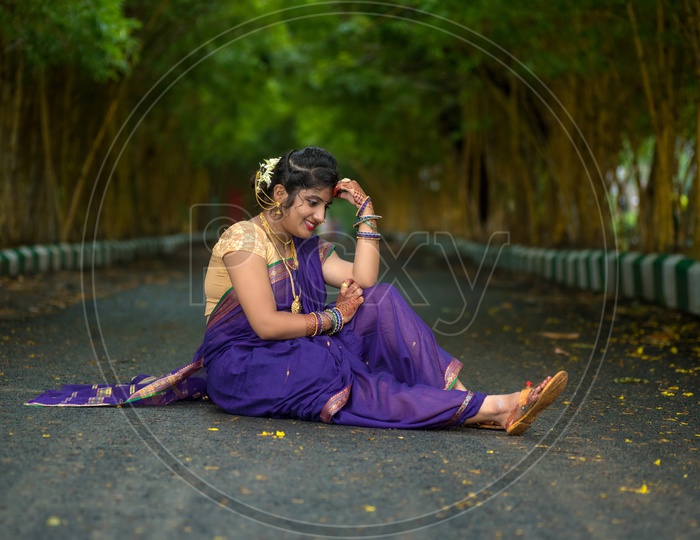 Image of Indian traditional Beautiful Woman Wearing an traditional Saree  And Posing On The Outdoor With a Smile Face-AL425040-Picxy