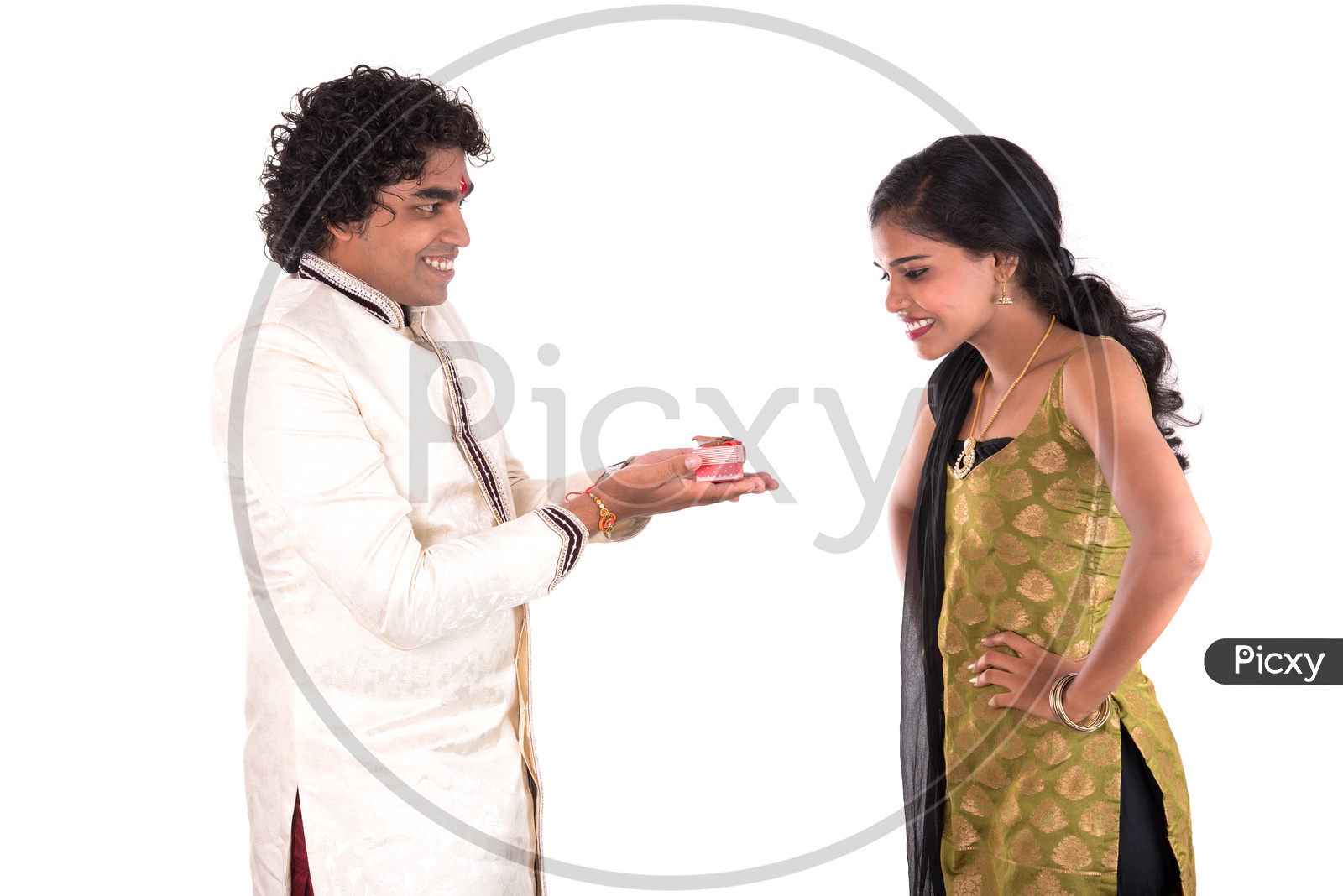 Brother Gifting His Sister With A Gift Box On The Occasion Of Rakhi Festival