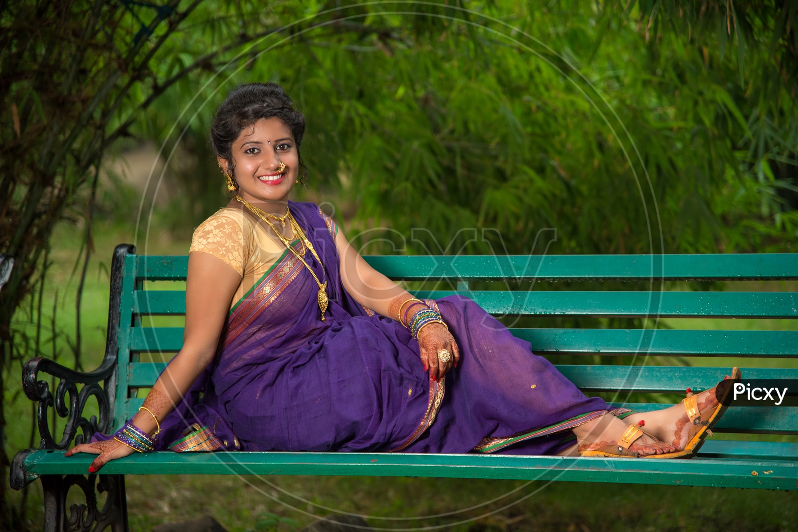 Image of Indian traditional Beautiful Woman Wearing an traditional Saree  And Posing On The Outdoor With a Smile Face-GQ993096-Picxy