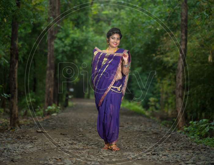 Beautiful Indian Young Girl In Traditional Saree Posing Outdoors Stock Photo,  Picture and Royalty Free Image. Image 147639275.