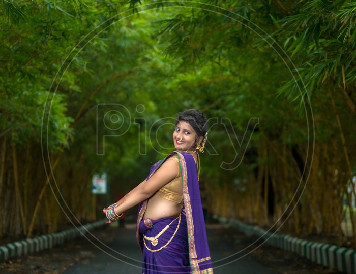 Beautiful Indian young girl in Traditional Saree posing outdoors 5578230  Stock Photo at Vecteezy