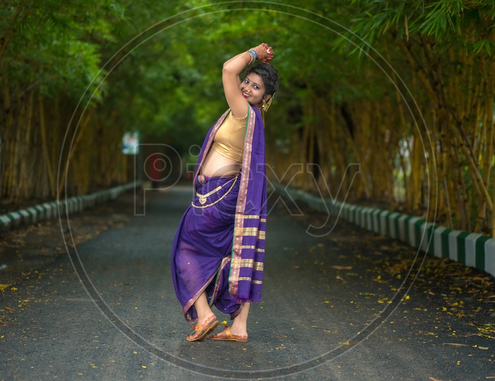 Premium Photo | Indian beautiful young girl in traditional saree posing  outdoors