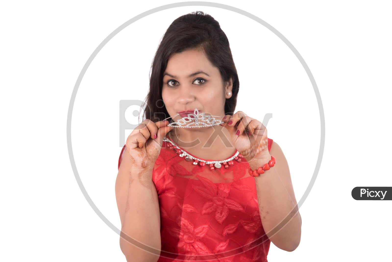 Portrait of a Beautiful Young Woman Standing And Posing With  A Queen Crown  On an Isolated white Background