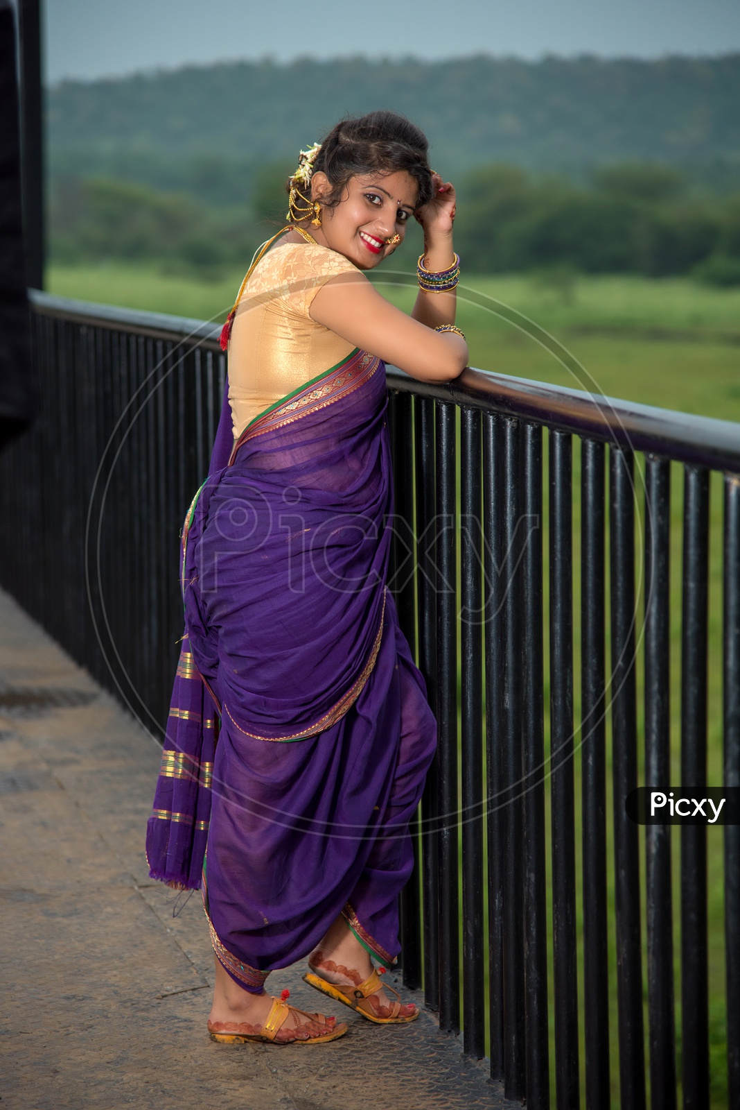 Image of Indian traditional Beautiful Woman Wearing an traditional Saree  And Posing On The Outdoor With a Smile Face-CW904167-Picxy