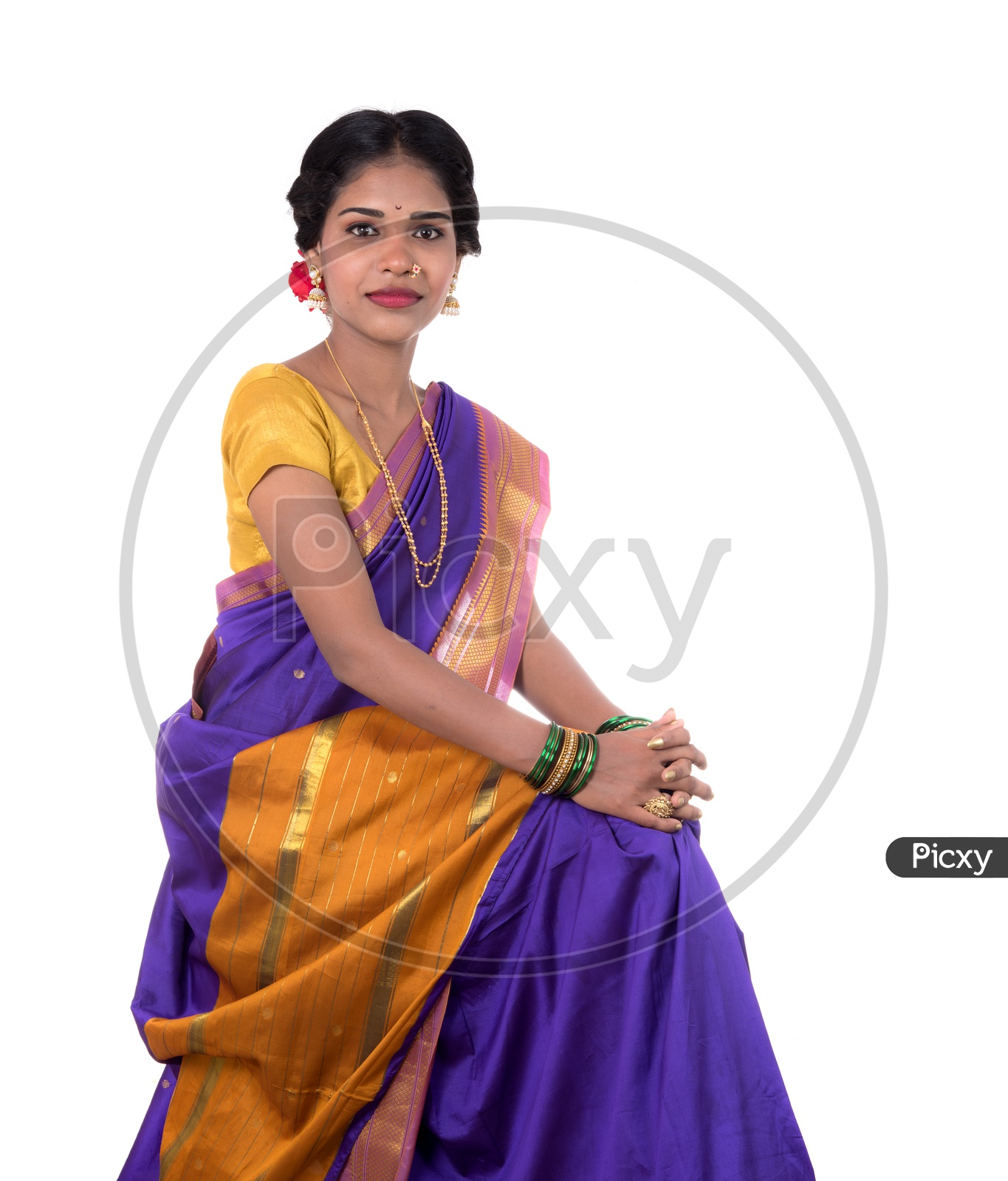 Portrait of a beautiful Indian girl in a greeting pose to Namaste hands.  India woman in traditional saree. Stock Photo | Adobe Stock