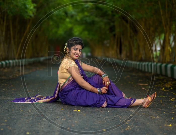 Image of Indian traditional Beautiful Woman Wearing an traditional Saree  And Posing On The Outdoor With a Smile Face-ZW844011-Picxy
