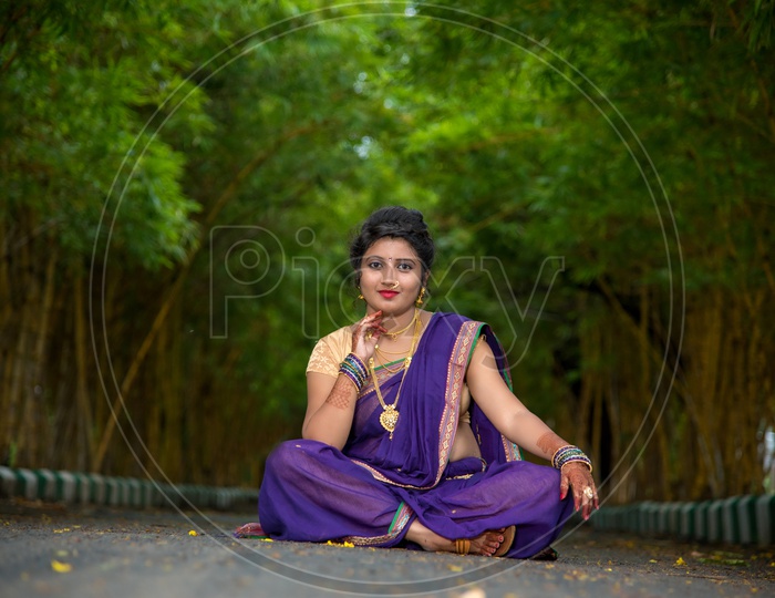 Beautiful Indian Young Girl In Traditional Saree Posing Outdoors Stock  Photo, Picture and Royalty Free Image. Image 147638584.